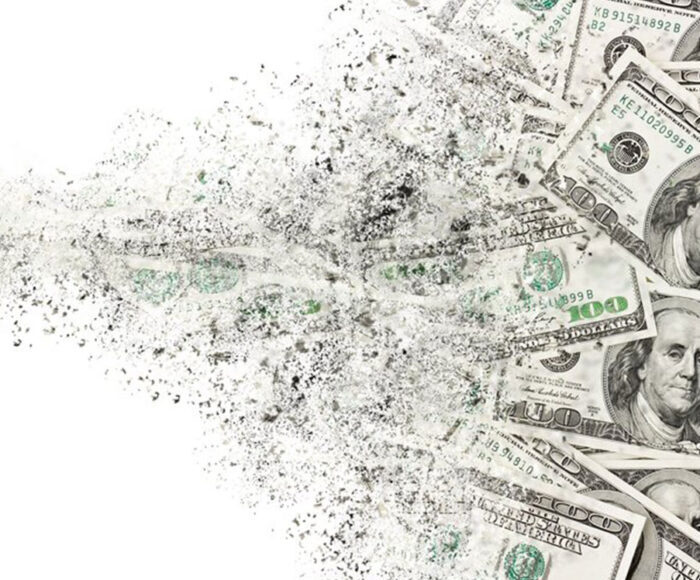 Group of $100 bills getting shredded