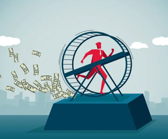 Businesman running on a hampster wheel